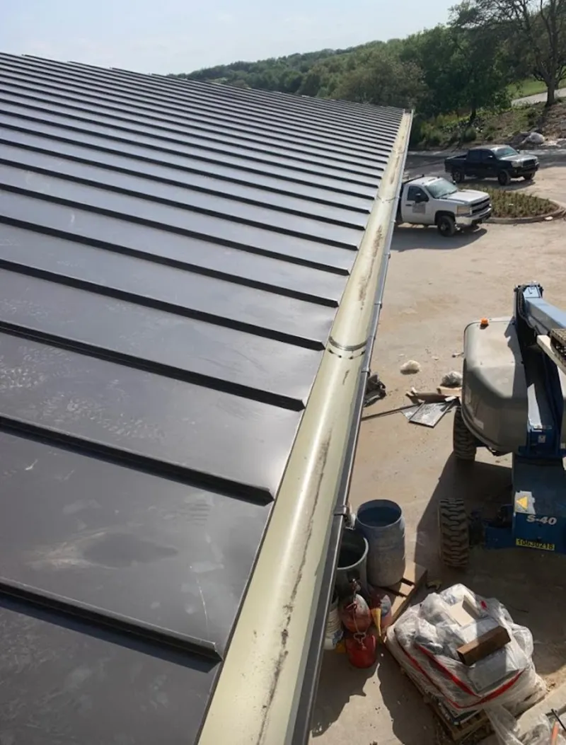 Standing seam panel and gutter detail on a metal roofing jobsite in Sausalito